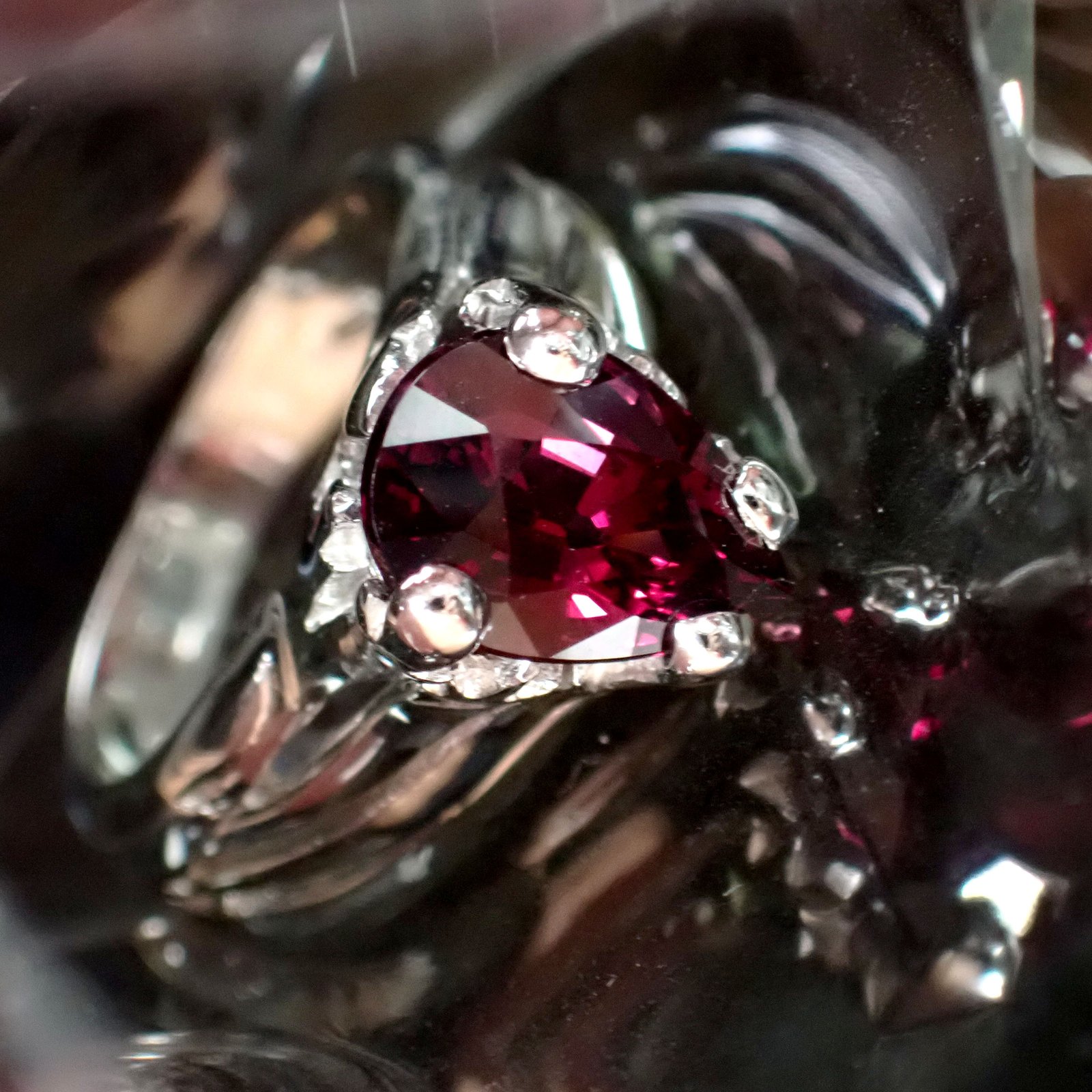 Root Under Rhodolite Ring
