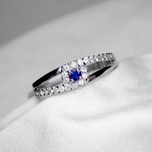 Blue Sapphire Ring with Asymmetric White Sapphire Accents - 1